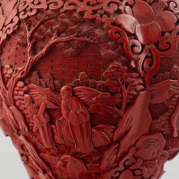 A red laquer vase, early 20th century.