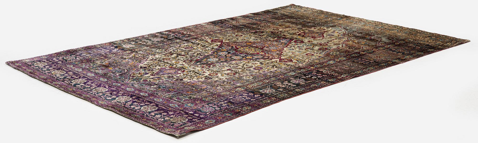 An antique silk Kashan rug, Central Persia, c. 207 x 131 cm.