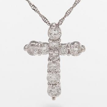 A platinum necklace with a cross pendant set with brilliant-cut diamonds 0.52 ct acording to engraving.