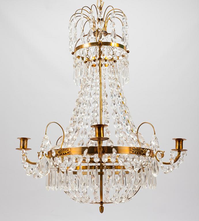 A Gustavian style chandelier from the first half of the 20th century. Height 67 cm.
