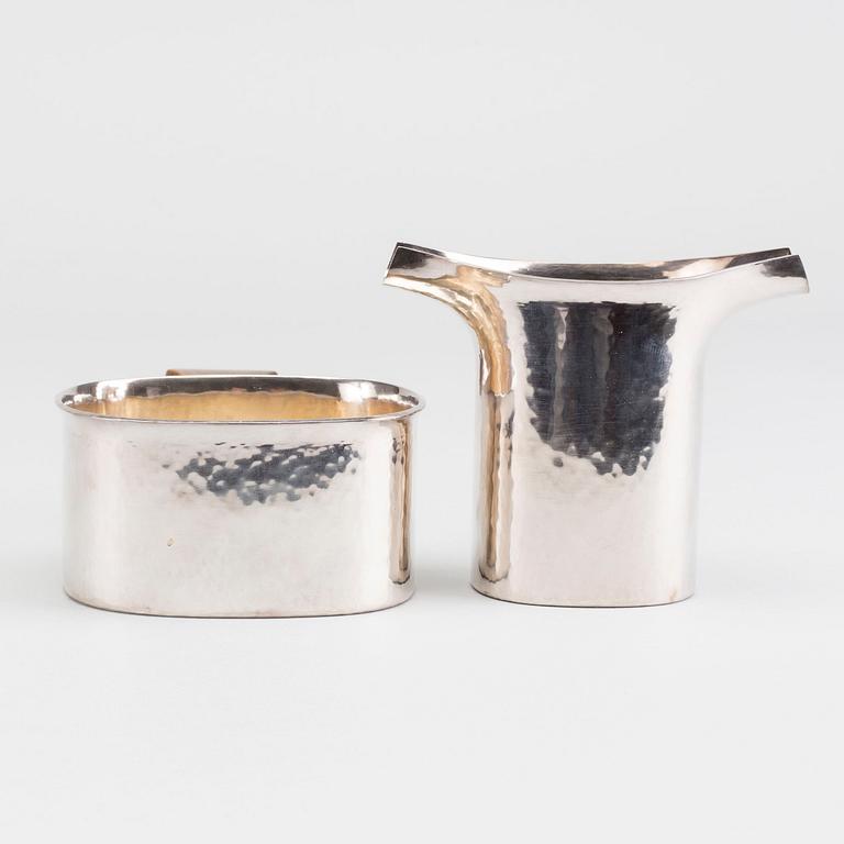 A Swedish 20th century set of sugarbowl and creamer, mark of H Decker Stockholm 1983 total weight ca 316 gr in total.