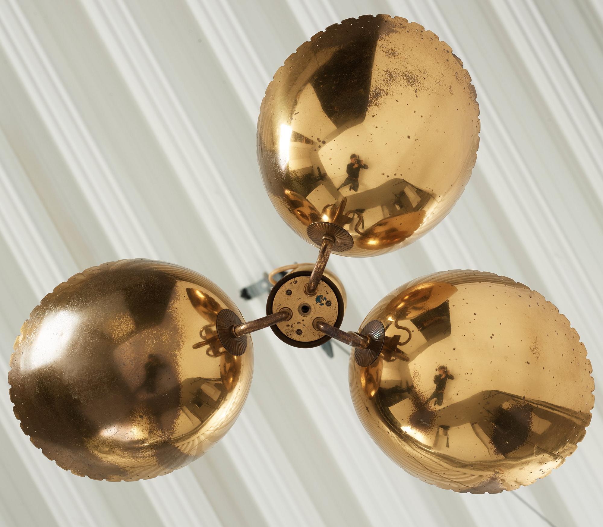 Carl-Axel Acking, probably, a Swedish Modern three light brass ceiling light, Arvid Böhlmarks Lampfabrik, 1940's.