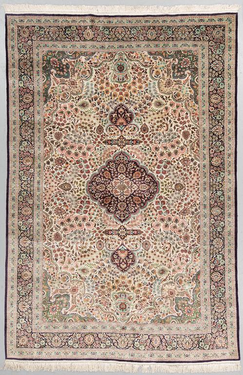 An orietal silk carpet, around 273 x 180 cm.