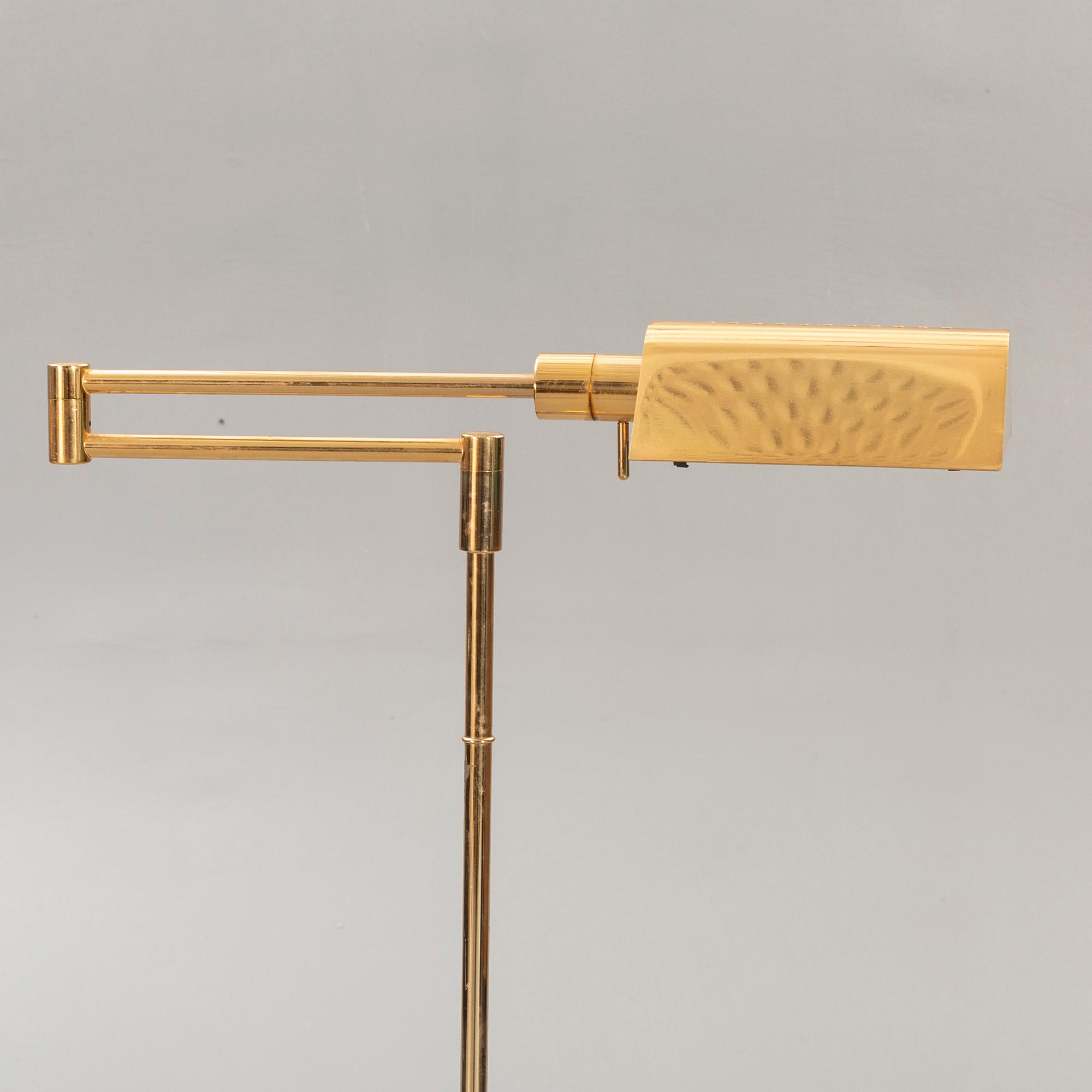A brass floor lamp later part of the 20th century.