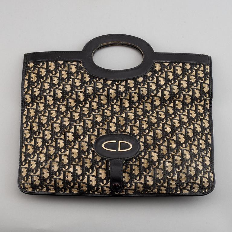 Christian Dior, a 'Oblique fold-over convertible clutch'.