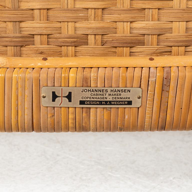 Hans J Wegner, a pair of teak and rattan "JH 516" easy chairs from Johannes Hansen, Denmark, 1950's/60's.