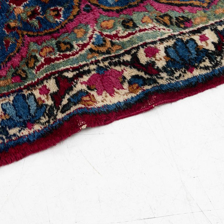 A Kerman carpet, c. 365 x 265 cm.
