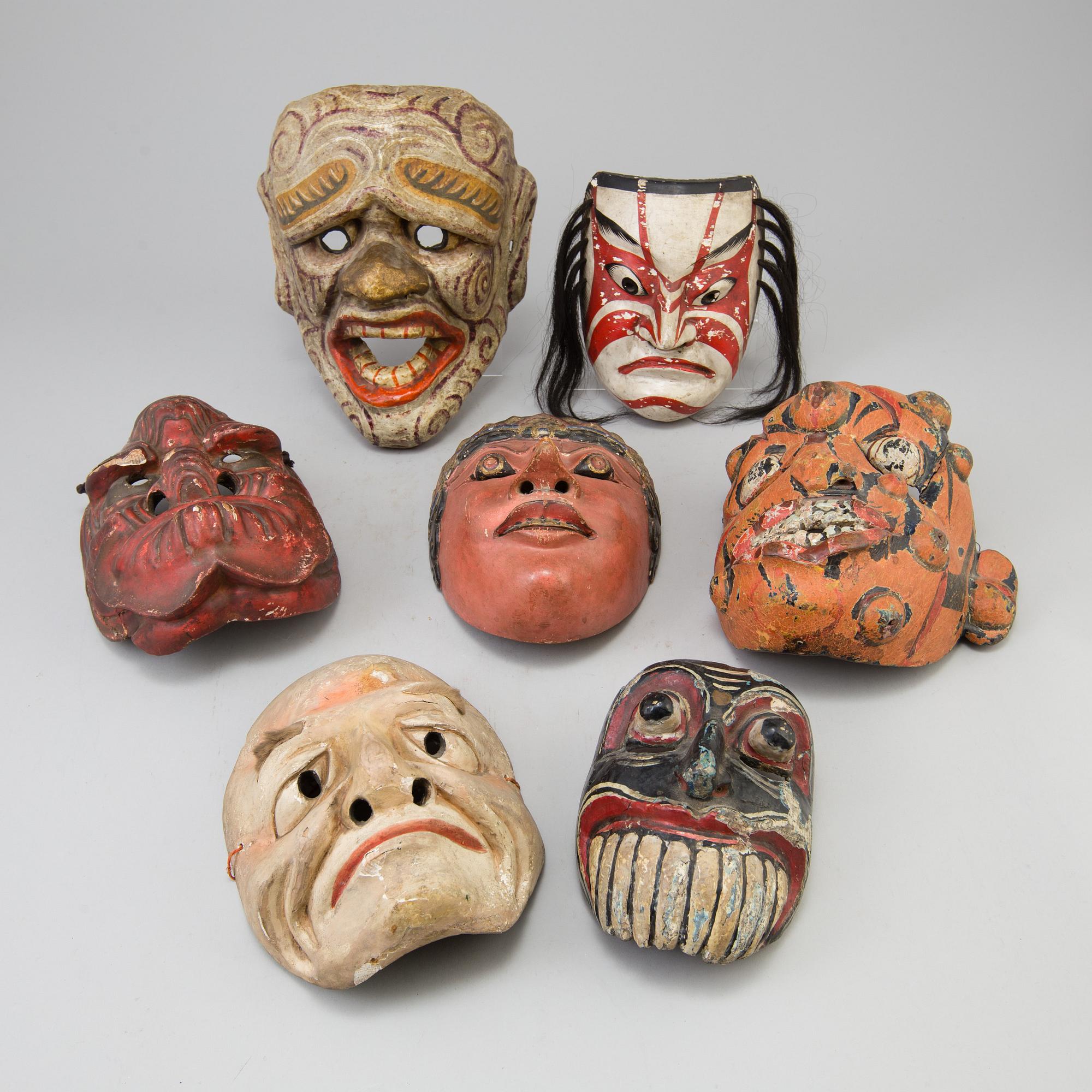 A group of dancing maskes, mostly Japanese Bugagku masks, Meiji period (1868-1912).