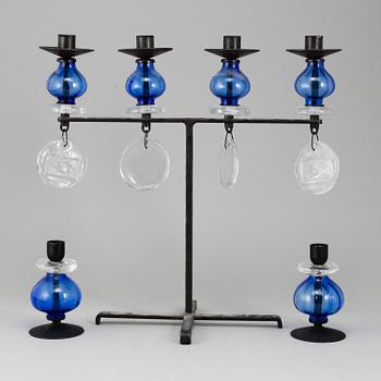 Erik Höglund, a wrought iron and glass candelabrum and pair of candelsticks from Boda Smide.