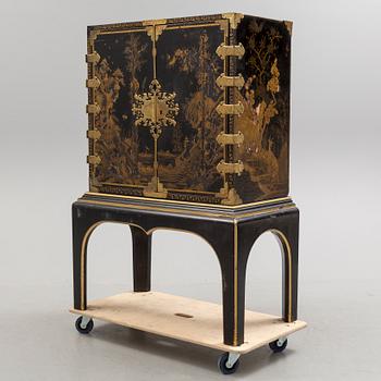 AN early 18TH CENTURY PROBABLY ENGLISH Japanned laquer cabinet on stand.