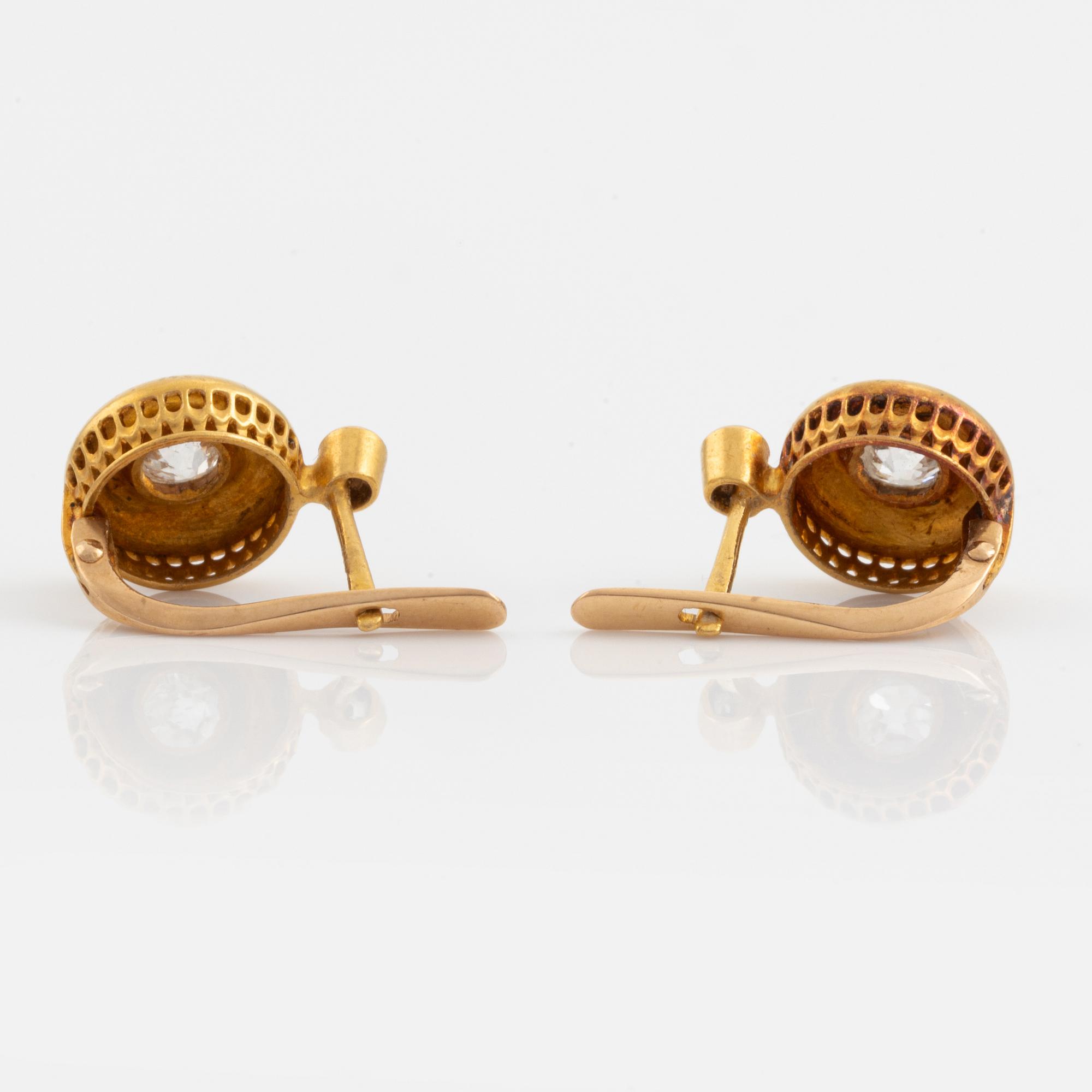 A pair of 18K gold earrings set with old-cut diamonds.