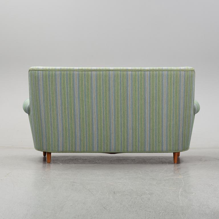 A second half of the 20th Century sofa by Carl Malmsten.