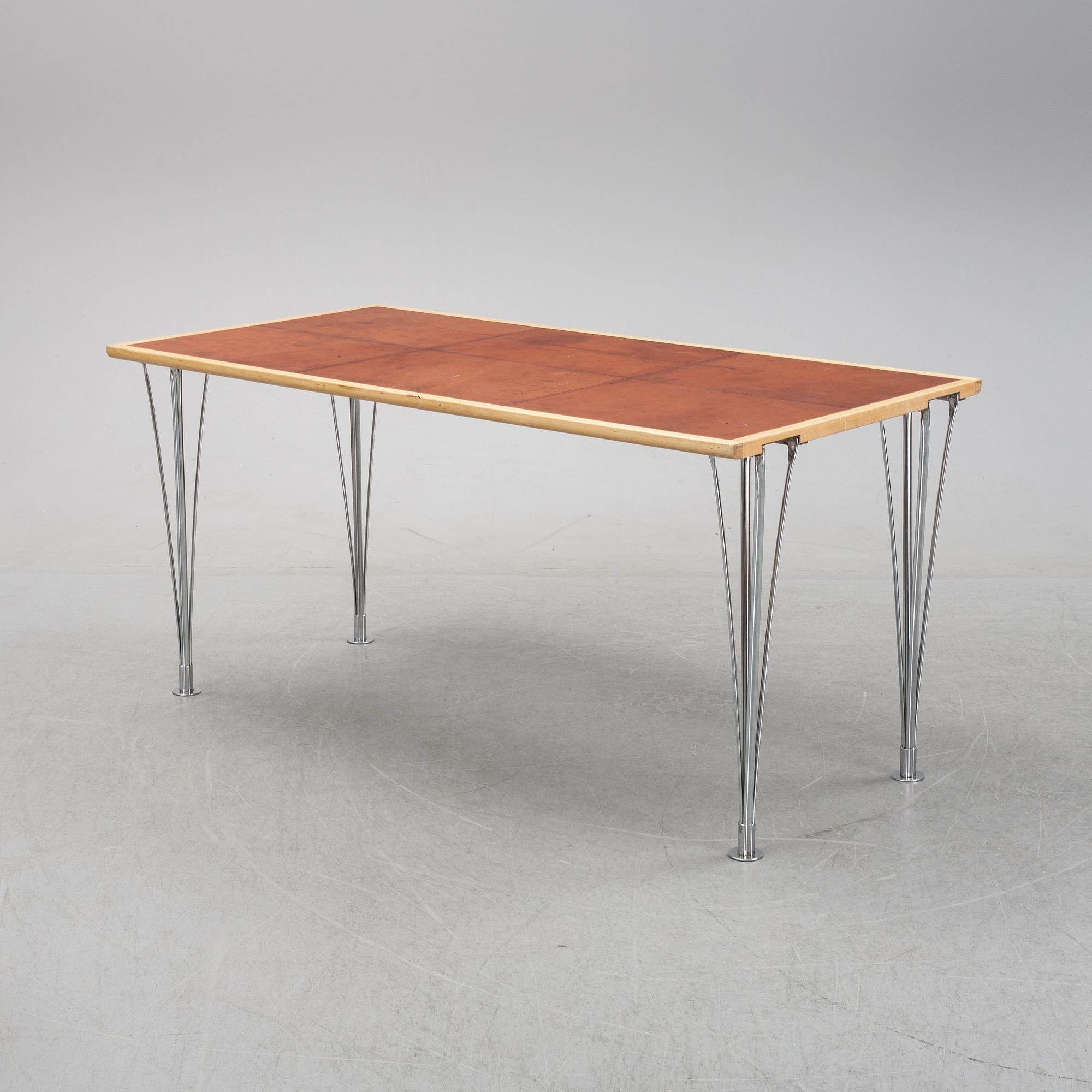 A birch and leather dining table produced by Mathsson International, 21th century.