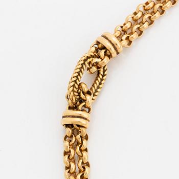 An 18K gold necklace retailed by WA Bolin.