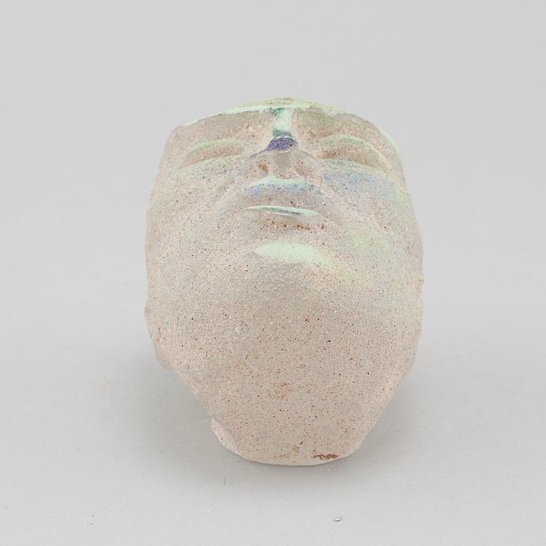 a glass object, signed.