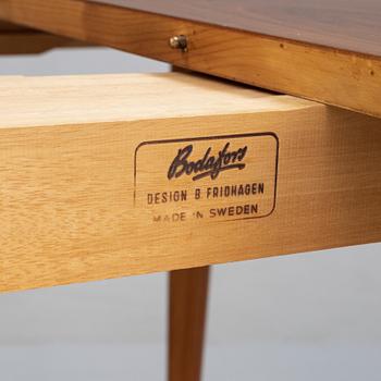 A walnut dining table by Bertil Fridhagen, Bodafors, 1960's.