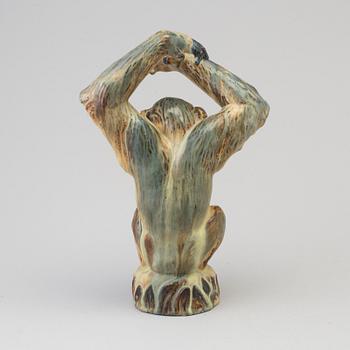 A Danish mid 20th century glazed ceramic figure of a chimpanzee, by Arne Ingdam.