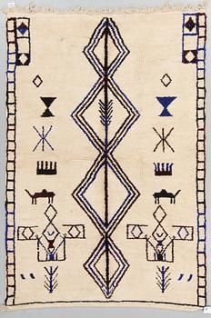 A rug from Morocco, around 227 x 158 cm.