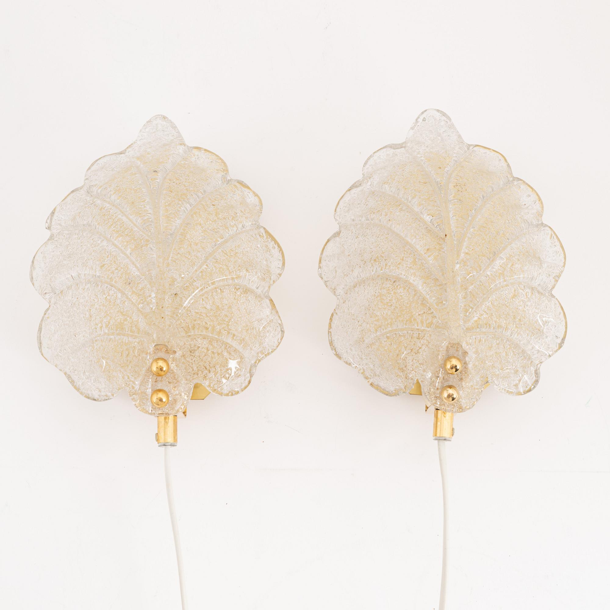 A pair of brass and glass wall lamps, Rejmyre Armaturfabrik, second half of the 20th century.