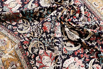 A Ghom silk carpet, approx. 309 x 200 cm.