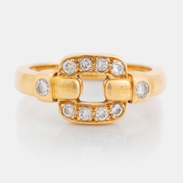 An 18K gold Cartier ring set with round brilliant-cut diamonds.