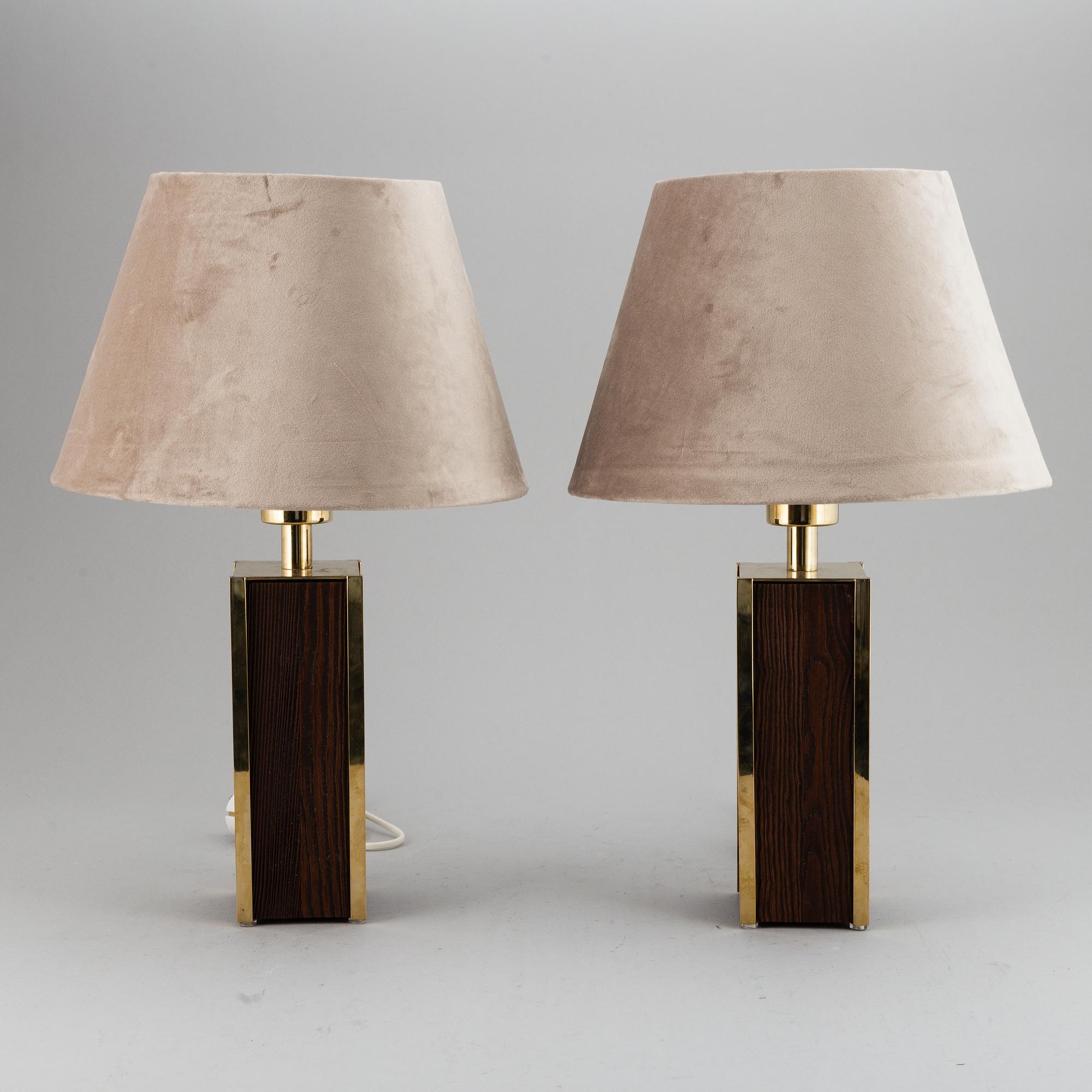 A second half of the 20th Century pair of pine and brass table lights.