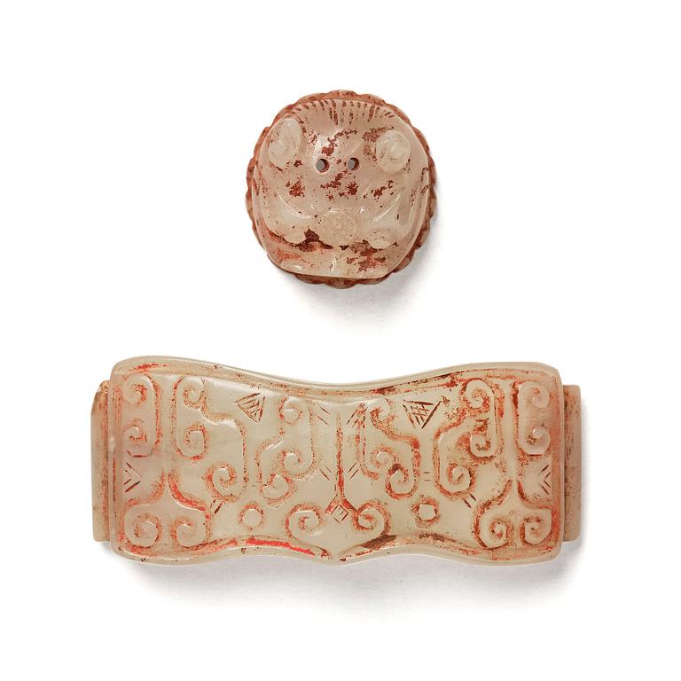 Two jade ornaments, presumably Neolitic.