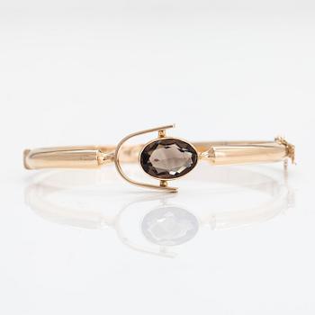 Eero Rislakki, a 14K gold and smoky quartz bracelet, Westerback, Helsinki 1960.