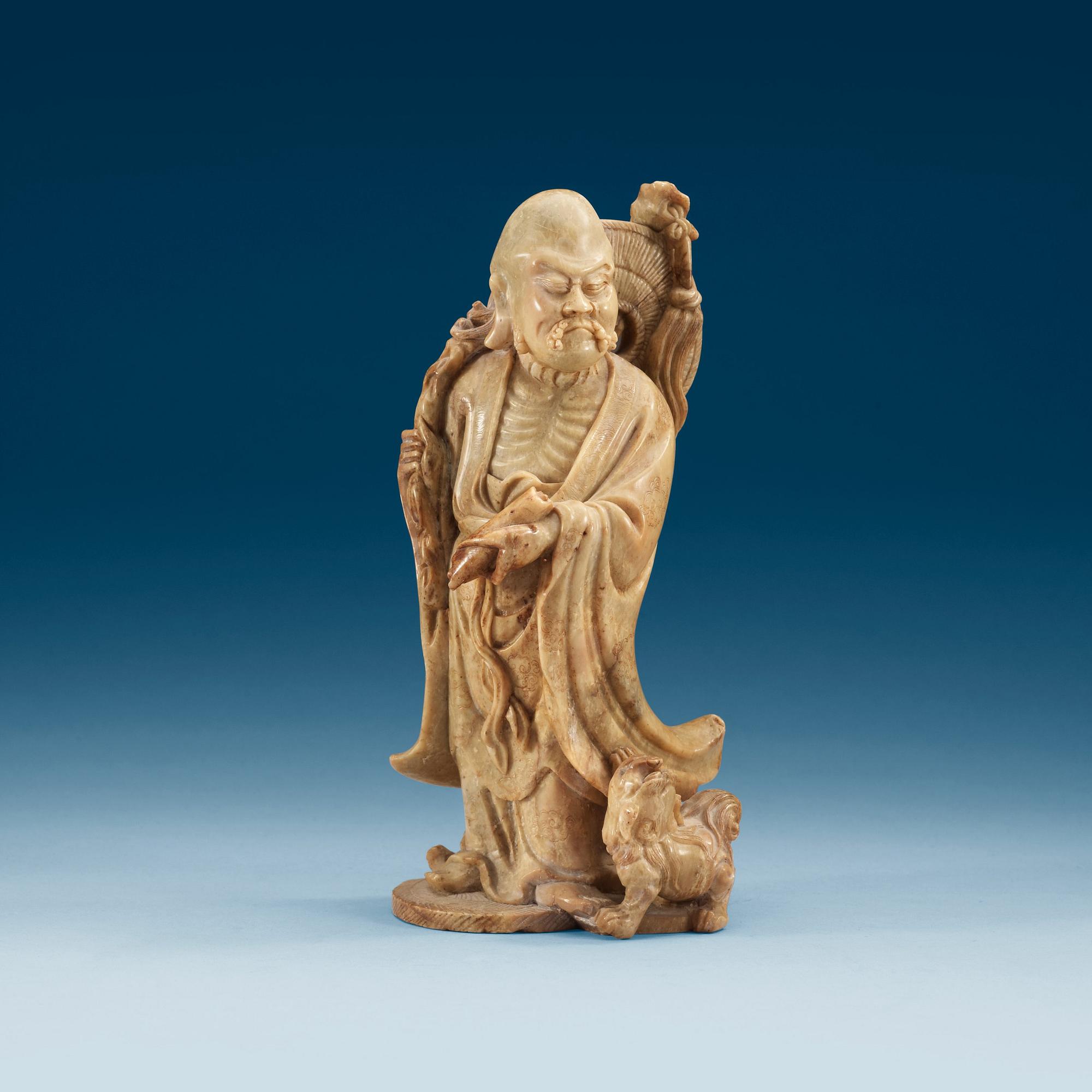 A soapstone figure of an immortal, Qing dynasty.
