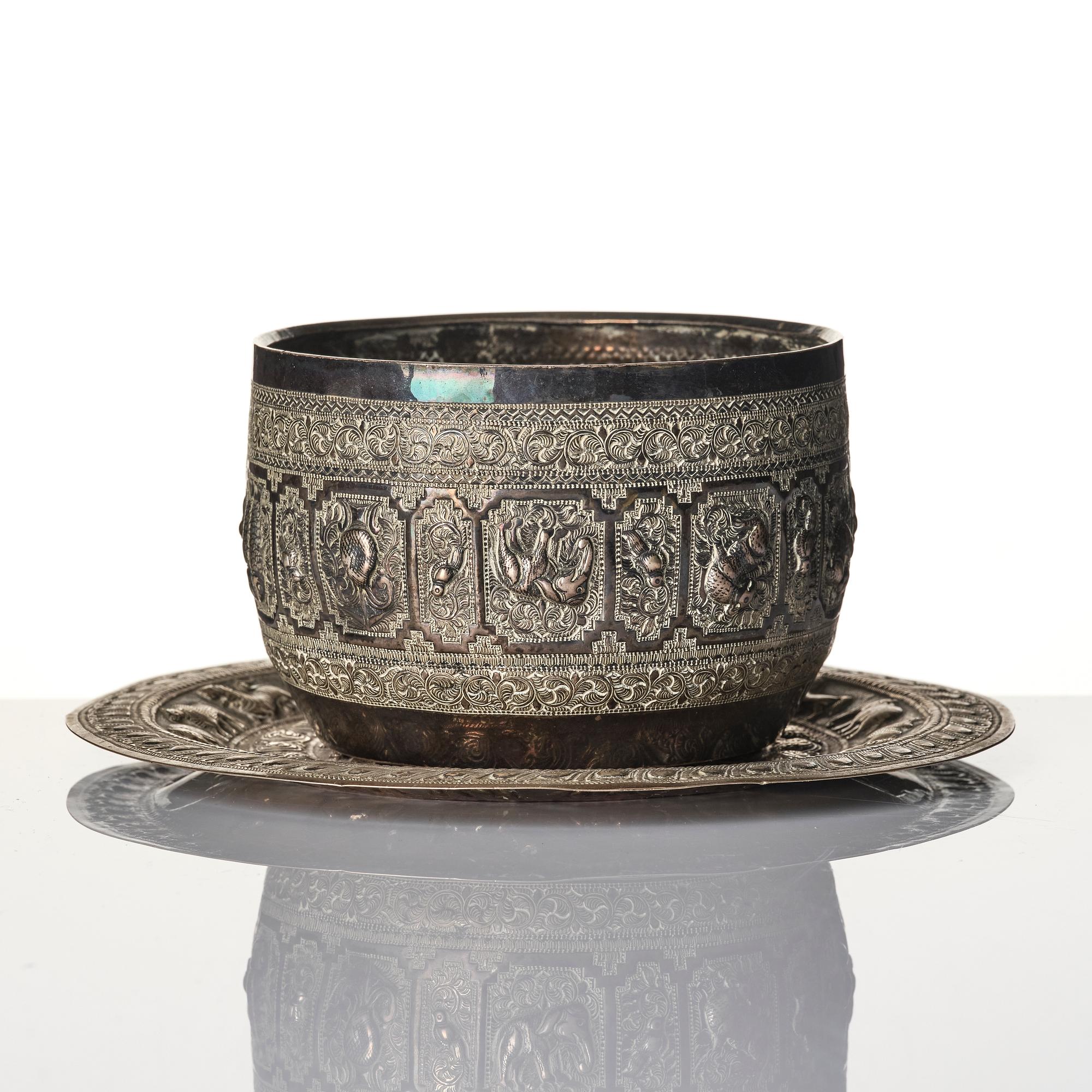 A Chinese brushpot, Qing dynasty, circa 1900. An archaistic bronze ewer and a silvered South East Asian bowl with stand.