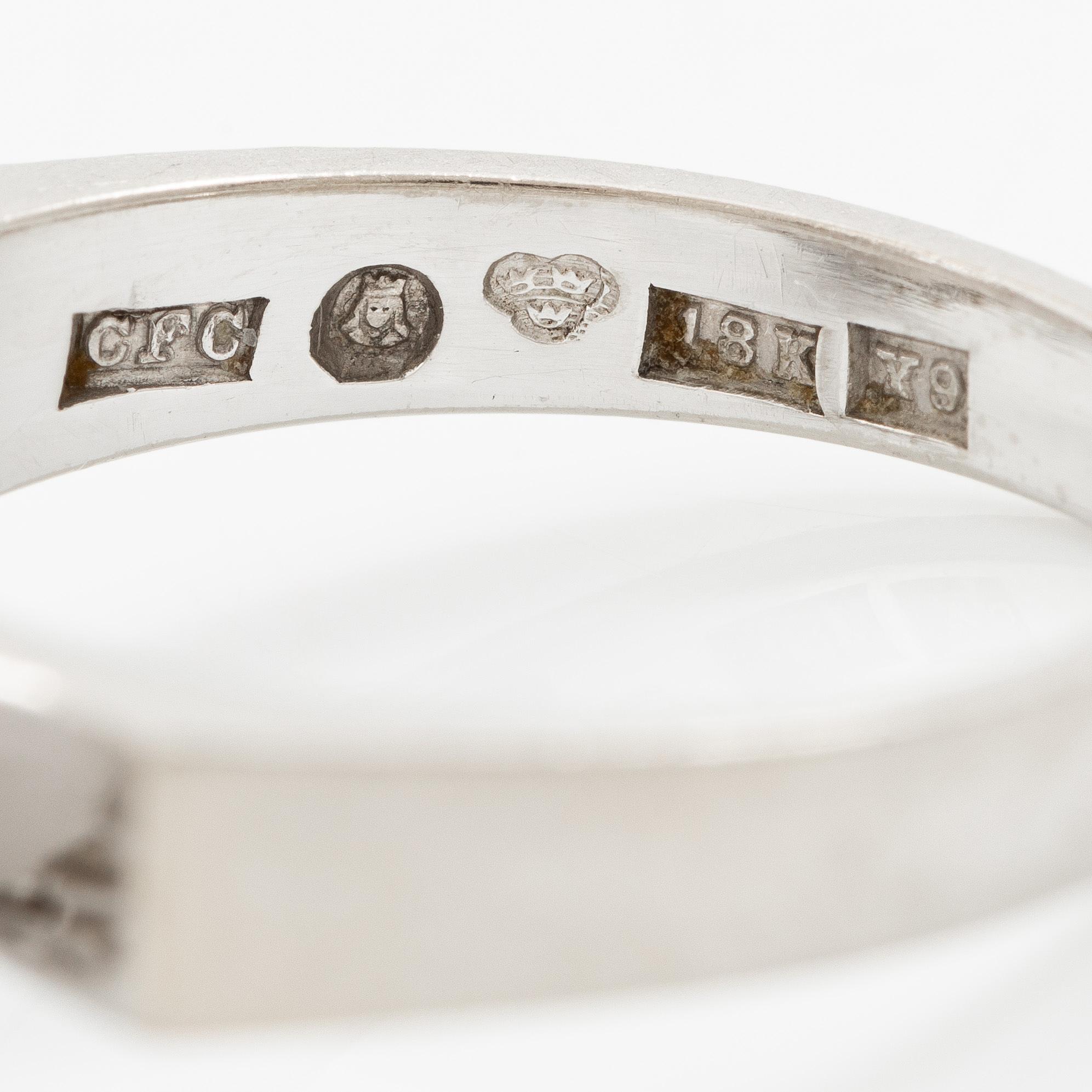 A ring 18K white gold set with an opal and eight-cut diamonds. CF Carlman, Stockholm 1973.