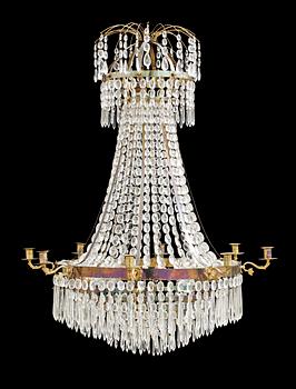 522. An Empire-style nine-light chandelier.