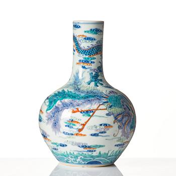 A doucai 'dragon and phoenix' vase, late Qing dynasty with Qianlong mark.