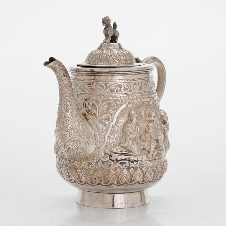 A silver teapot, China.