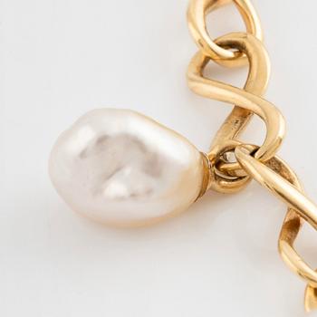 An 18K gold and cultured Keshi pearl bracelet.