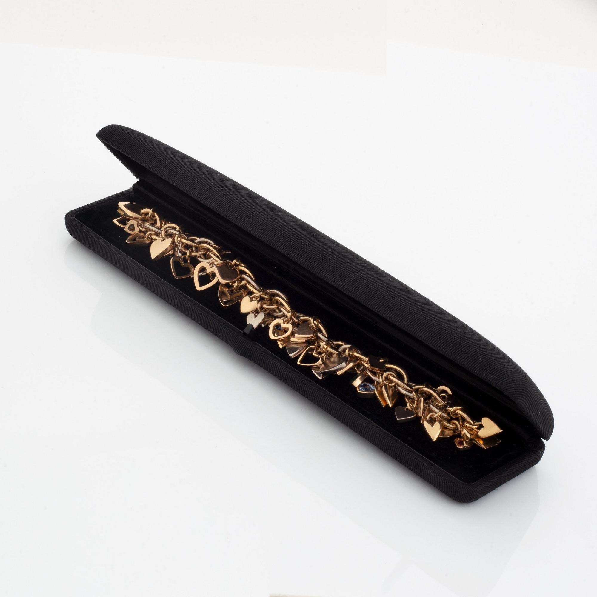 An 18K gold Gaudy bracelet with heart shaped charms.