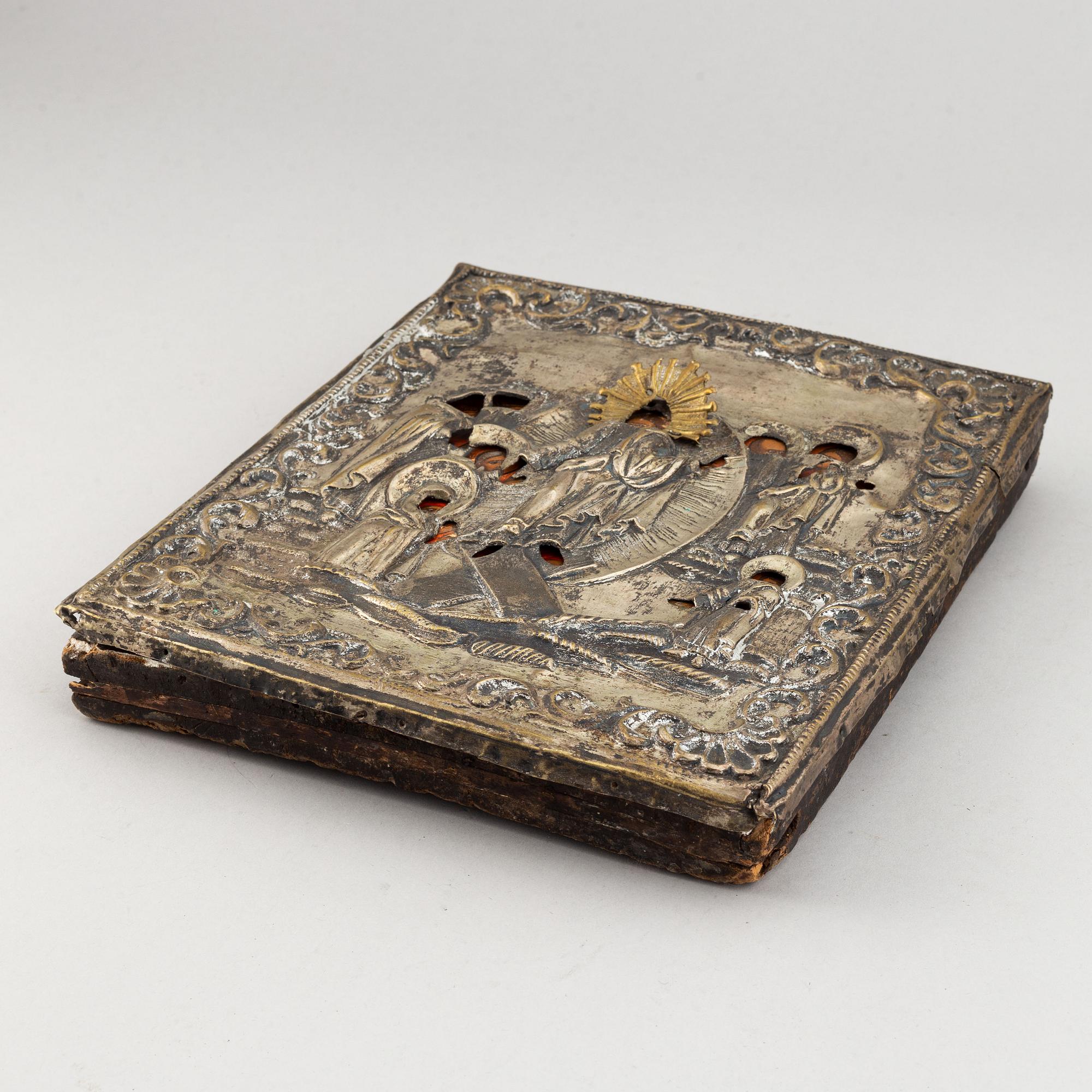 A russian icon with ochlad, rempera on panel, 19th Century.