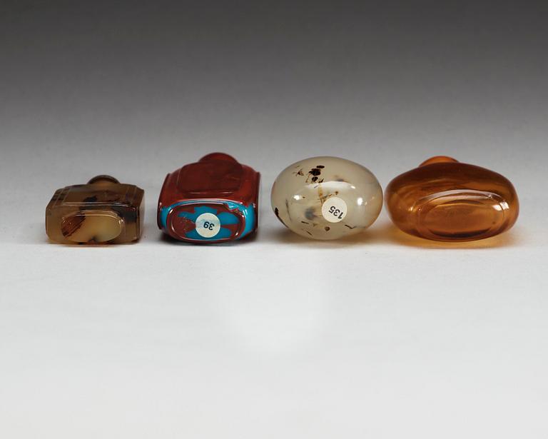 A set of four glass and stone snuff bottles, Qing dynasty.