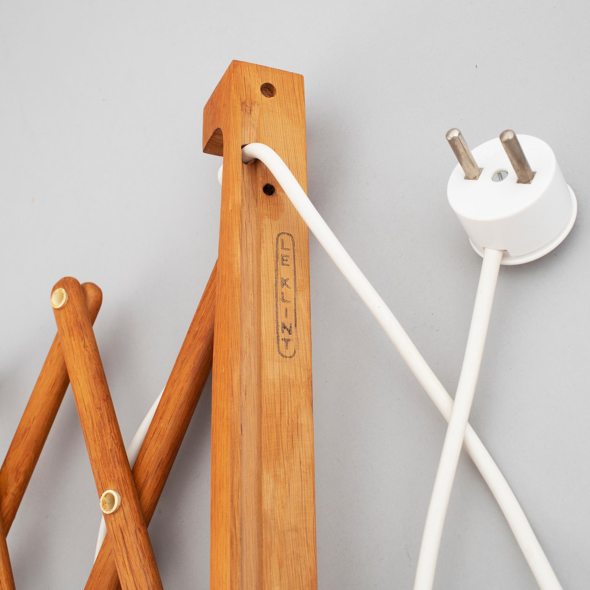 Two Le klint wooden wall lamps.