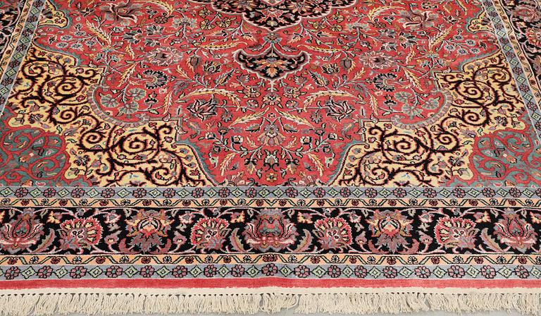 A Kashmir silk carpet, approx. 305 x 216 cm.