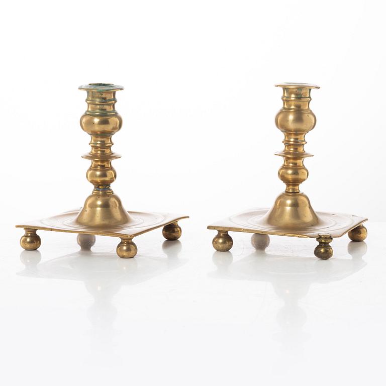 A pair of North European baroque brass candlesticks, circa 1700.
