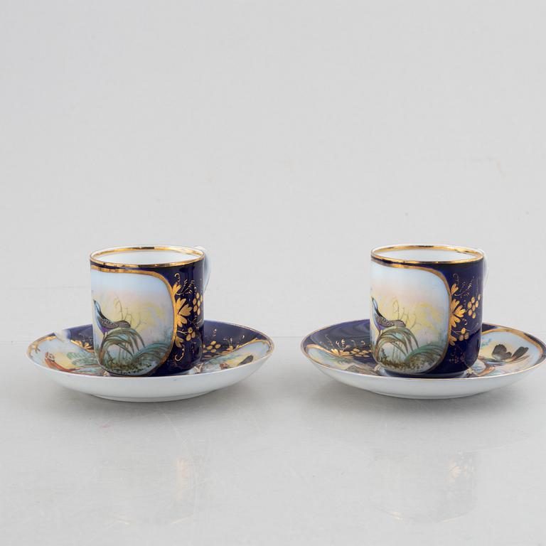 A set of nine porcelain coffee cups with saucers, Kuznetsov, Russia (1891-1917).