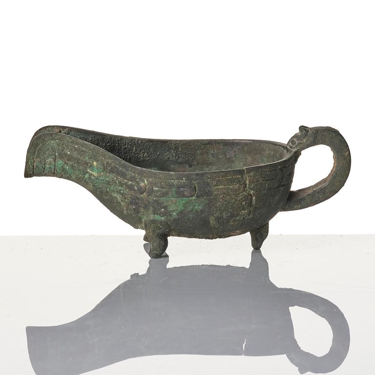 A Chinese brushpot, Qing dynasty, circa 1900. An archaistic bronze ewer and a silvered South East Asian bowl with stand.