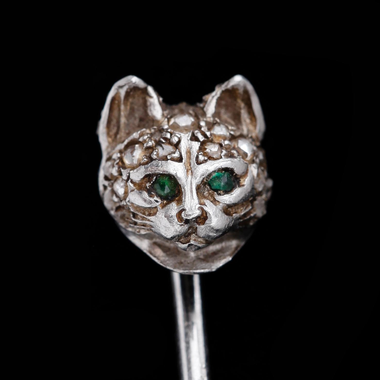 Cartier, A Cartier rose cut diamond and emerald tie pin.
