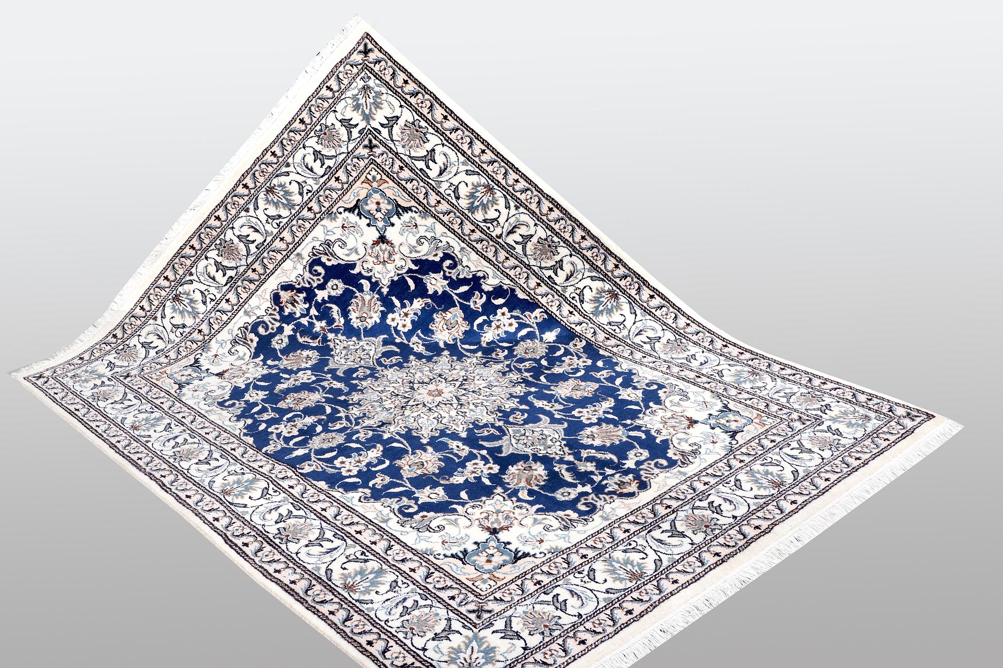 A Nain rug, part silk, ca 205 x 152 cm.
