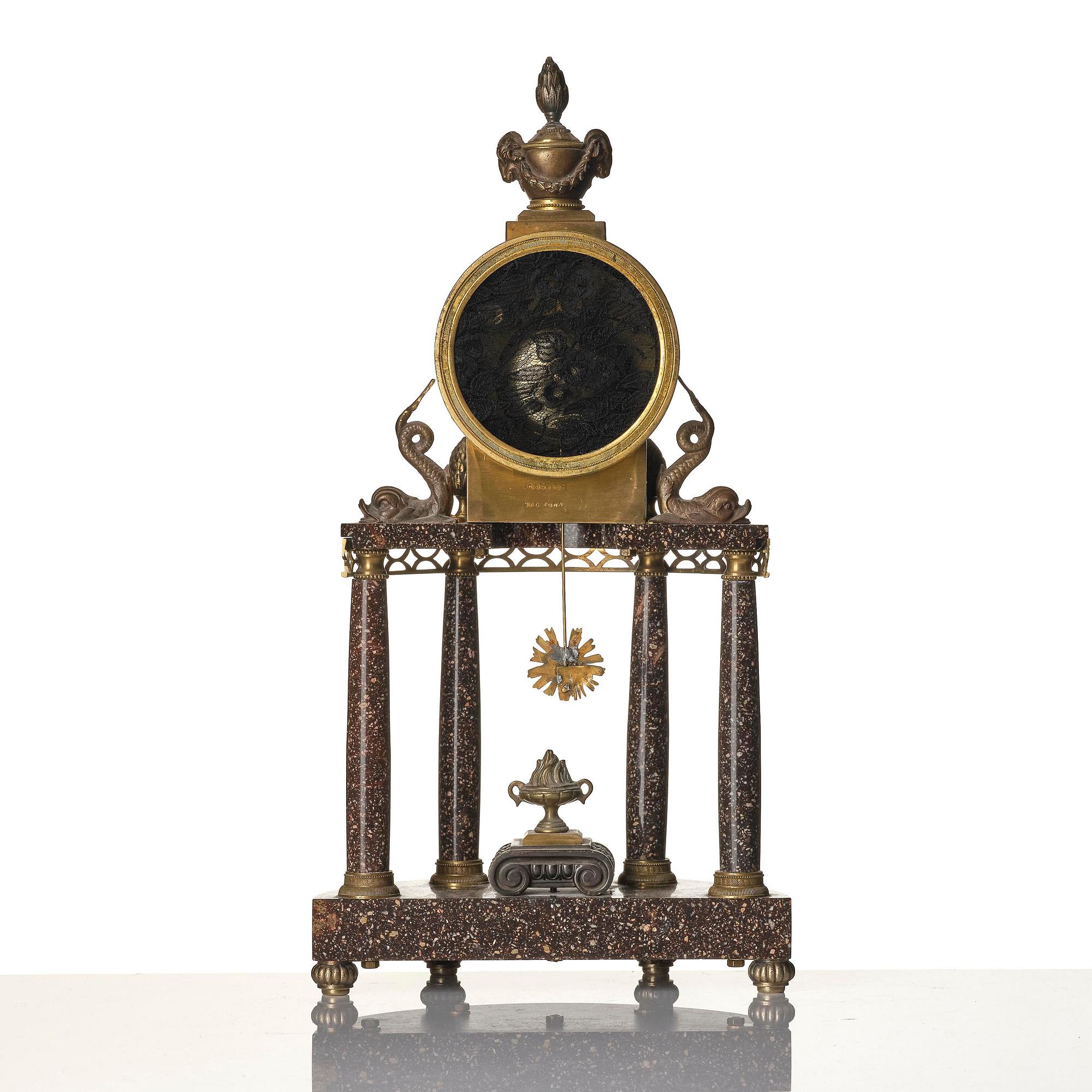 A late Gustavian ormolu and 'Blyberg' porphyry portico clock by E. Engelbrechten (watchmaker in Stockholm 1815-45).