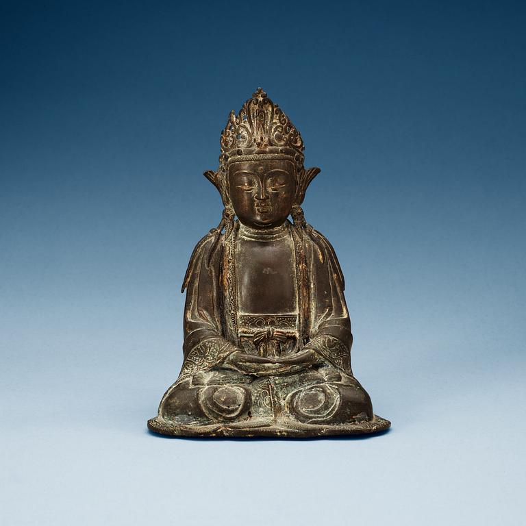 A bronze figure of a seated Guanyin, Ming dynasty.