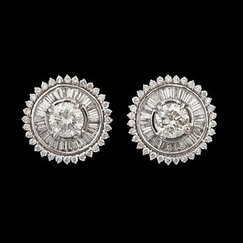 1091. A pair of  brilliant- and tapered baguette-cut diamond earrings. Total carat weight circa 4.05 cts.