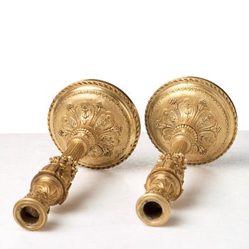 A pair of Louis XVI-style 19th century candlesticks by Raingo Frères, Paris.