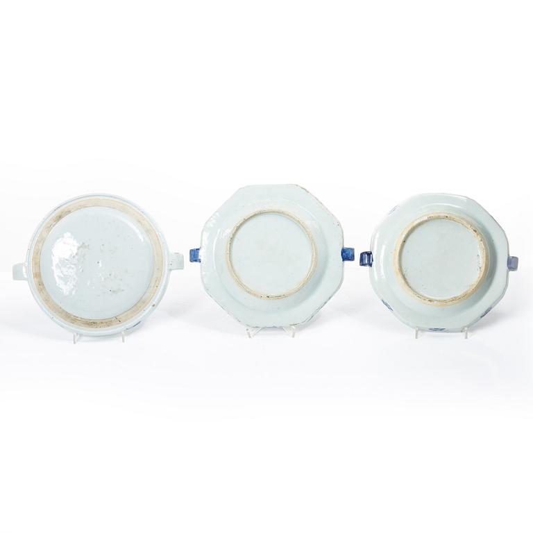 A group of three Chinese blue and white porcelain hot water dishes, Qing dynasty, 18/19th century.